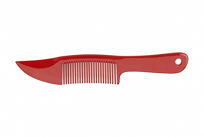 Comb  at, 2005. A knife-like comb for the handbag to have a psychological weapon close at hand when out walking. Obtained by the hybridization of a comb and a combat knife hence the name Comb-at  it is manufactured in plastic with the tip not considered to be a real weapon. 