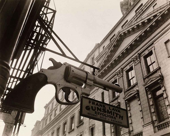 Berenice Abbott, Gunsmith and Police Station, New York, 1937.  Berenice Abbott/Commerce Graphics/Getty Images. Courtesy of Howard Greenberg Gallery, New York
