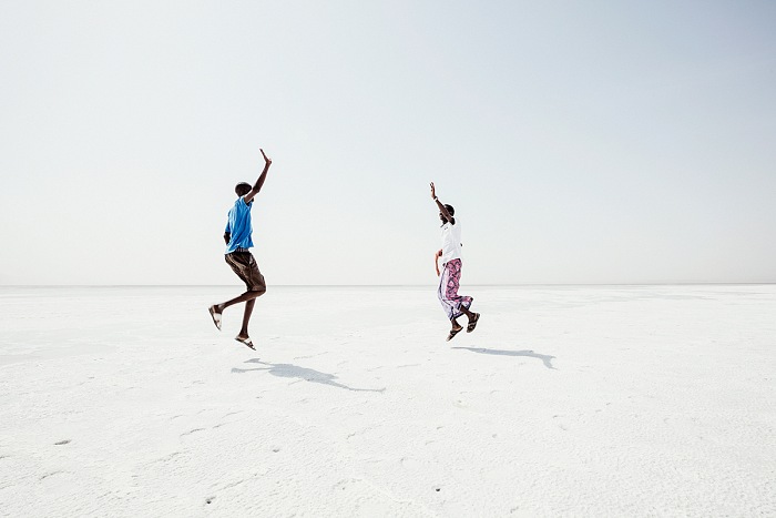 Andrea Frazzetta, Assal, Salt Plain. The white surface of the Salt Lake.  Andrea Frazzetta. Ali meets his friend Mohamed who also works as a guide for tourists in the Danakil. Happy to meet again, they improvise a Keke dance