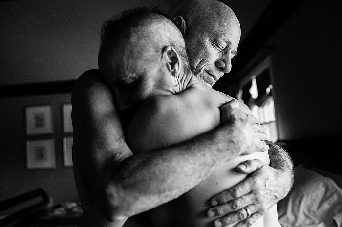 Chappaqua, New York. March 2013.
Howie and Laurel Borowick embrace in the bedroom of their home.
In their thirty-four year marriage, they never could have imagined
being diagnosed with stage-4 cancer at the same time.  Nancy Borowick.