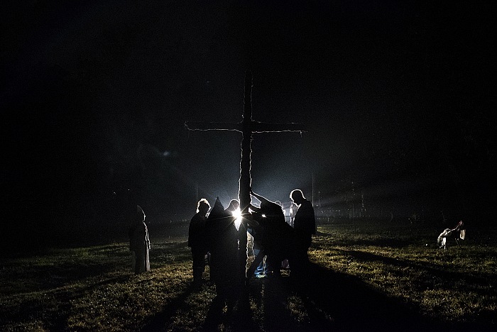 Tennessee. USA, 2015. A cross lighting after the wedding of two members of the KKK. For the KKK, the cross symbolizes Jesus Christ lighting their path (though burning the cross is taboo in most sects of Christianity). Through the history of the KKK it has also often been burned on the property of African Americans in order to intimidate them.  Peter Van Agtmael/Magnum Photos.