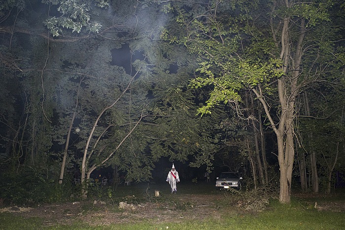 Maryland. USA, 2015. A member of the KKK after a cross lighting/burning.  Peter Van Agtmael/Magnum Photos.